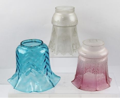 THREE VICTORIAN/EDWARDIAN DECORATIVE GLASS LAMP SHADES; one pink graduated tint with etched decoration, one blue shade and on