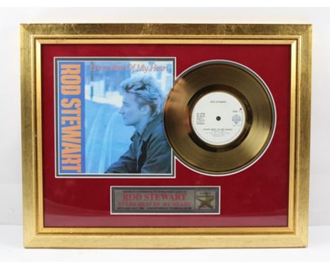 A LIMITED EDITION COLLECTOR'S ITEM RELATING TO "ROD STEWART", A FRAMED "... 24 CARAT GOLD PLATED RECORD ...." no. 26/500, com