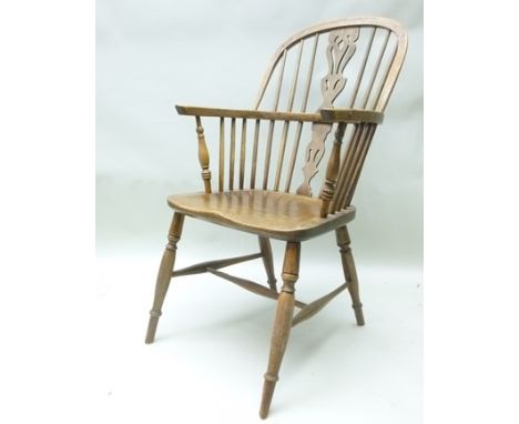  LATE 19TH/EARLY 20TH CENTURY DOUBLE COMB BACK WINDSOR CHAIR having yew and ash super structure, elm seat and beech turned ri