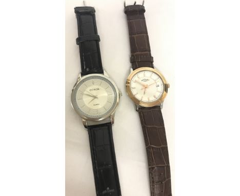 2 men's wristwatches. A Citron with silver face and black strap.  Together with a Rotary watch with rose gold tone, white and