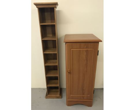 2 modern pine CD cabinets.  A slim 7 shelf open shelf unit, approx. 115cm T x 22cm W,  together with a single door cupboard w