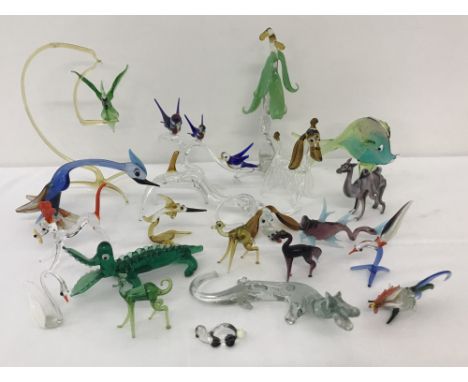 A collection of vintage clear and coloured glass animal ornaments.  To include birds, dogs, fish and crocodiles (some pieces 