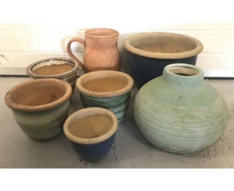 A collection of ceramic and terracotta garden plant and flower containers.  Comprising: 5 flower pots, a garden vase and a te