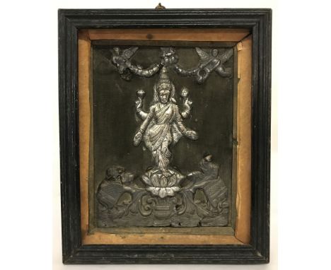 A framed vintage white metal plaque of the Hindu goddess Lashmi.  Possibly Indian silver.  Frame size approx. 28cm x 23cm.