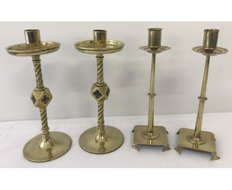 2 pairs of vintage brass candlesticks.  To include a heavy pair with twisted stems and quatrefoil detail. 