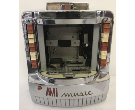 A vintage AMI Music wall box selector juke box. For spares or repair.   Approx. 32cm wide x 40.5cm tall.