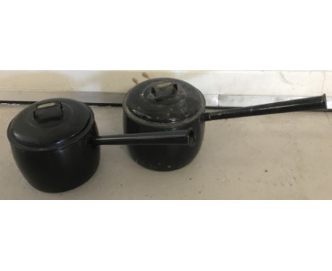 2 lidded Judgeware black enamel saucepans; 12 and 10 pints.  