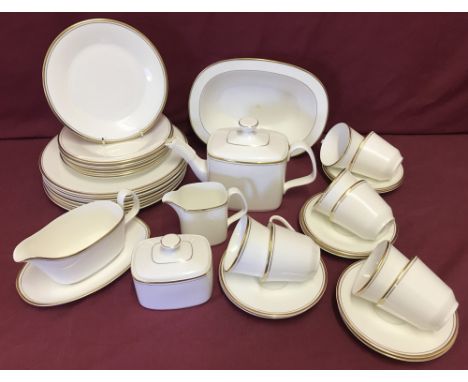A quantity of first quality Royal Doulton "Gold Concorde" tea and dinner ware, HN5049.  Comprising: Teapot, 8 cups &amp; sauc