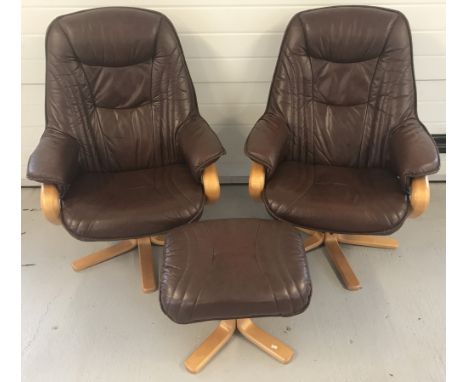 2 modern design matching brown leather and light wood swivel and reclining armchairs.  Complete with matching footstool. 