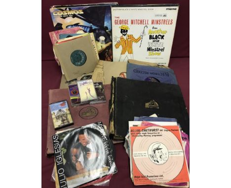 A box of assorted vintage tapes and records.  To include 78's, LP's, 7" singles and tapes. By an assortment of artists from d