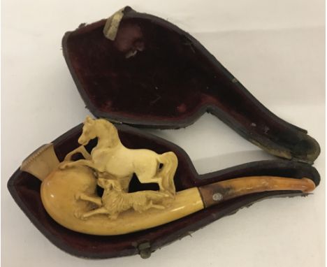 An antique cased Meerschaum pipe carved horse and hound detail to bowl.  Repair to stem. 