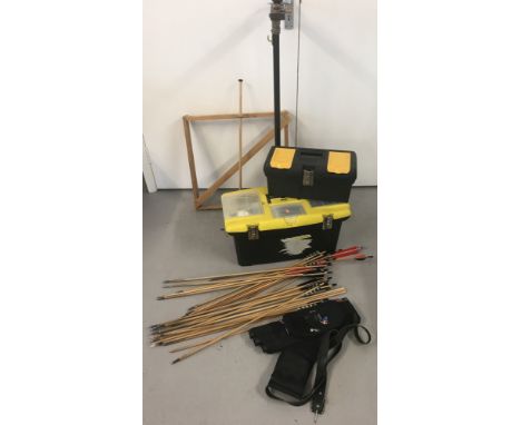 A collection of archery accessories, tools & parts. To include an arrow stand, 2 arrow rests, a modern quiver, 2 toolboxes of