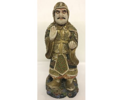 A Japanese heavy ceramic divine figurine, hand painted and heavily gilded.  Approx. 31cm tall.