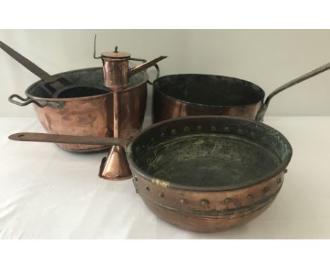 A collection of vintage copper cooking utensils to include large saucepans.   Largest approx. 30cm diameter.