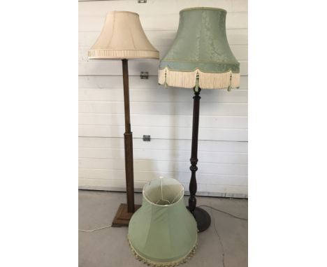 An Art Deco standard lamp with stepped base and cream shade.  Together with a modern mahogany standard lamp with round base a