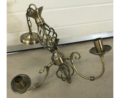 A modern brushed brass finish 3 arm ceiling  light fitting.  With central twist detail.  Total hanging length 60cm.