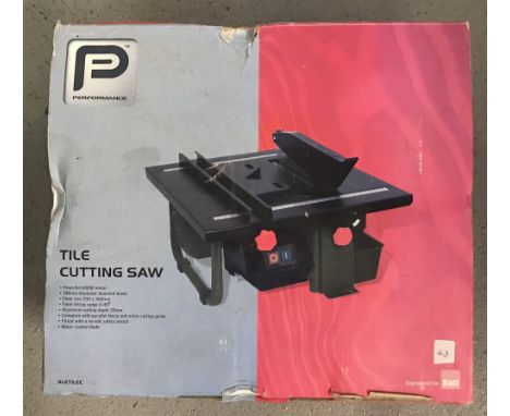 A boxed and unused Performance Power Tools 600W tile cutting saw.  