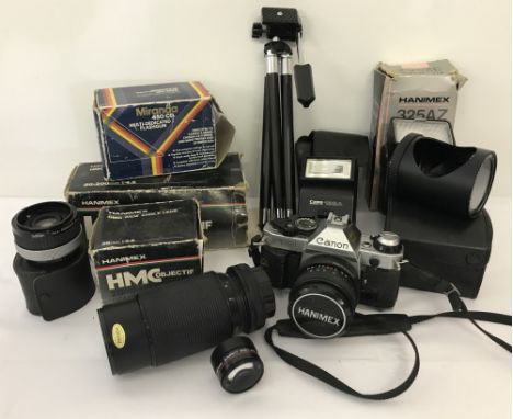 A vintage Canon AE-1 program camera.  Together with a selection of Hanimes lenses to include HMC Objective 80-200mm f?4.5 and