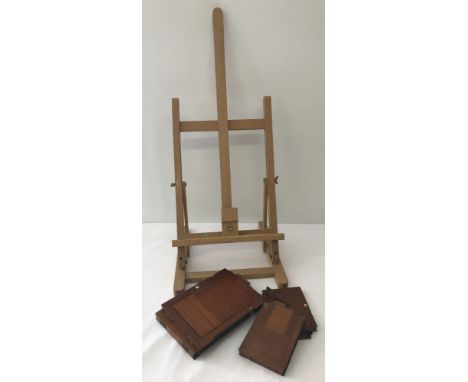 A small light wood artists easel together with a collection of vintage wooden cases  for photographic prints. 