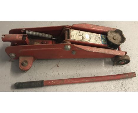A vintage trolley jack and handle.  