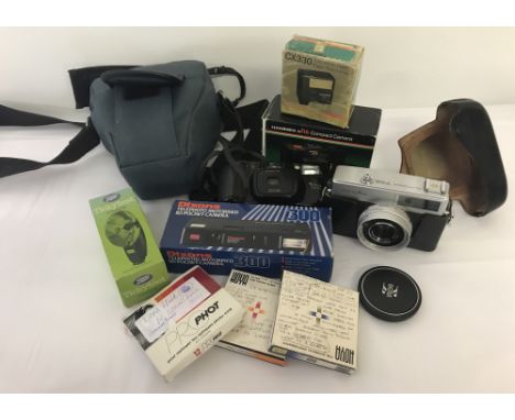 A collection of 4 vintage cameras and assorted accessories. To include a Hanimex HS35 compact camera; Dixons 110 pocket; Mino