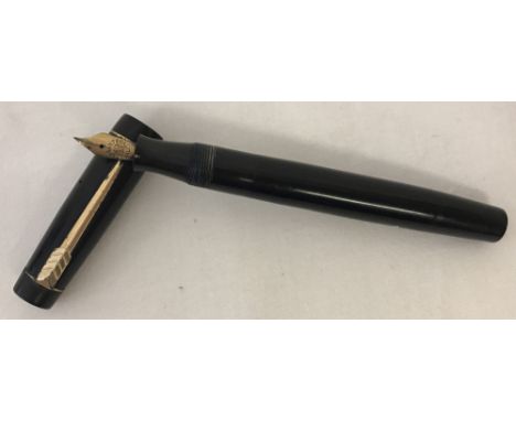 A vintage "The Croxley Pen" with 14ct gold nib.  Black case with gold coloured metal trim and screw top lid. Marked "A Dickin