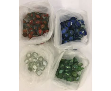 A collection of red, blue, green and white vintage cats eye marbles.  