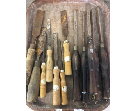 A quantity of vintage wooden handled carpenters and wood turning chisels.  