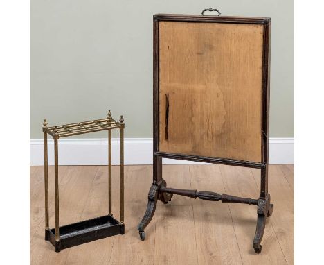 A 19th century brass and cast iron stick stand, 35cm wide x 58cm high; together with a 19th century mahogany firescreen, 56cm