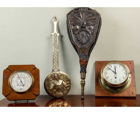 A brass ship's clock by Mercer, 20cm diameter mounted on a hardwood stand; together with a Short &amp; Mason aneroid baromete
