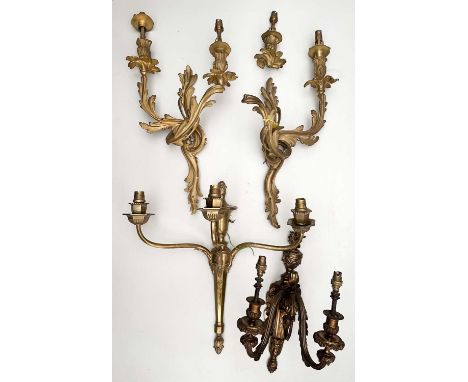 Six pairs of antique gilt metal wall lights, a triple branch wall light and further twin branch wall lightsAt present, there 