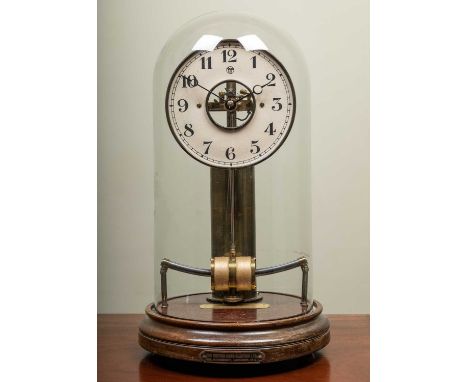 A bull type-a electric mantle clock under a glass dome with label to the base for The British Horo-Electric Ltd, Kingsway, Lo