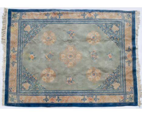 A Chinese light blue ground carpet with floral decoration and blue border, 314cm x 244cmStains, marks and minor damages overa