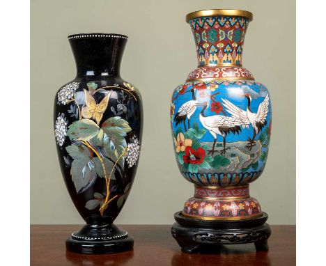 A decorative cloisonne vase on a carved wooden base, 30cm high overall including base; together with an enamel decorated glas