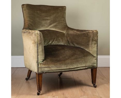A 19th century green upholstered small armchair with square tapering front legs terminating in ceramic casters, 67cm wide x 6