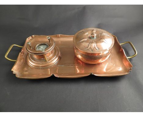 An Art Nouveau copper tray with brass handles and a copper table top warmer