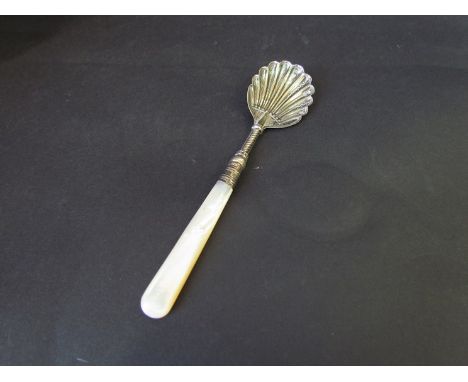 A silver scallop form spoon with mother of pearl handle, Birmingham 1899 