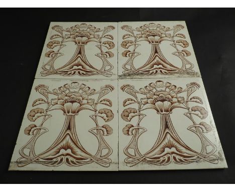 A set of four Art Nouveau wall tiles 