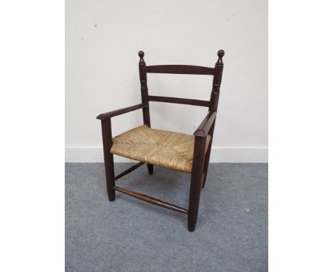A child's ladder back chair with rush seat 