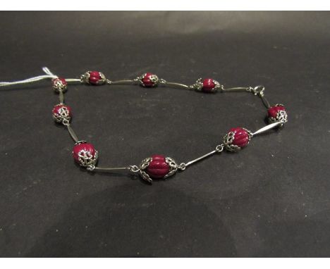 Vintage Art Deco Cornelian red, crystal and moulded glass fruit bead necklace. The bead joined with filigree white metal circ