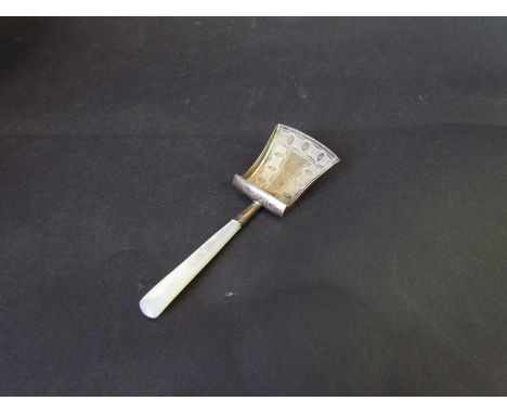 A Georgian silver tea caddy spoon of shovel form with mother of pearl handle 