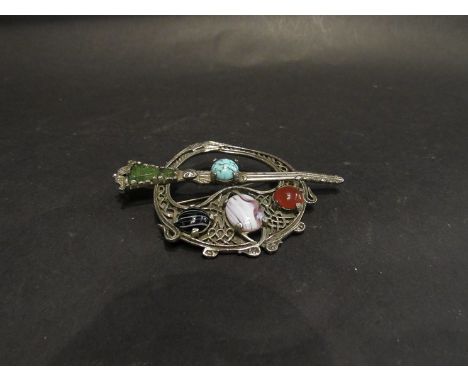 A Scottish Celtic brooch by Miracle, 80's vintage sword and shield, four faux precious stones with safety clasp, 9cm x 6cm