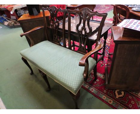 A Chippendale style mahogany two seater chair back sofa on three cabriole front legs