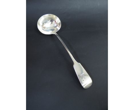 A Victorian silver soup ladle, London 1875 with crested handle, 256g