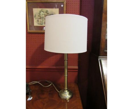 A bronzed table lamp with cream shade,  60cm tall 