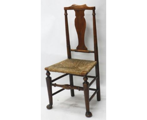 An 18thC fruitwood country chair, with comb top, hourglass splat, rope seat, and turned front legs terminating in pad feet, 1