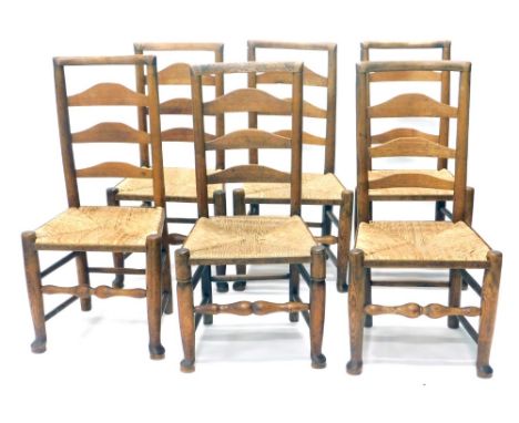 A set of eight 19thC Lancashire ash and elm ladder back chars, each with rope seats on turned legs, terminating in front pad 