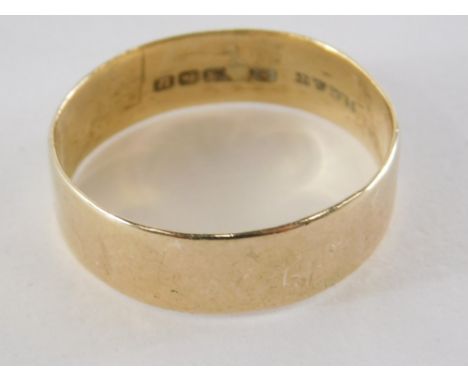 A 9ct gold wedding band, of plain design, ring size T½, 3.8g all in.