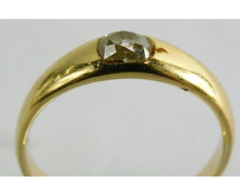 An 18ct gold solitaire ring, set with old cut diamond approx 0.23 carats in a rub over setting, the yellow metal band stamped