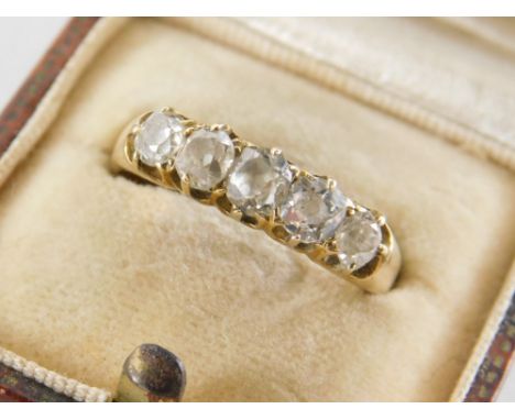 A five stone diamond set dress ring, with five old cut diamonds, of graduated size, the largest 0.15 carat, the smallest 0.05